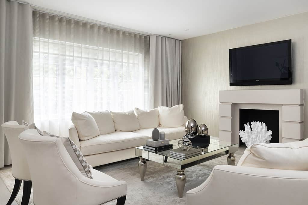 Our interior designers in Hertforshire use natural light and subtle neutral colors in this living room.
